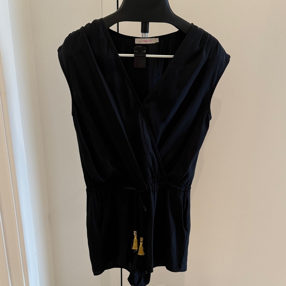 Alice & Trixie Black Sleeveless V-Neck romper with Gold Tassels!